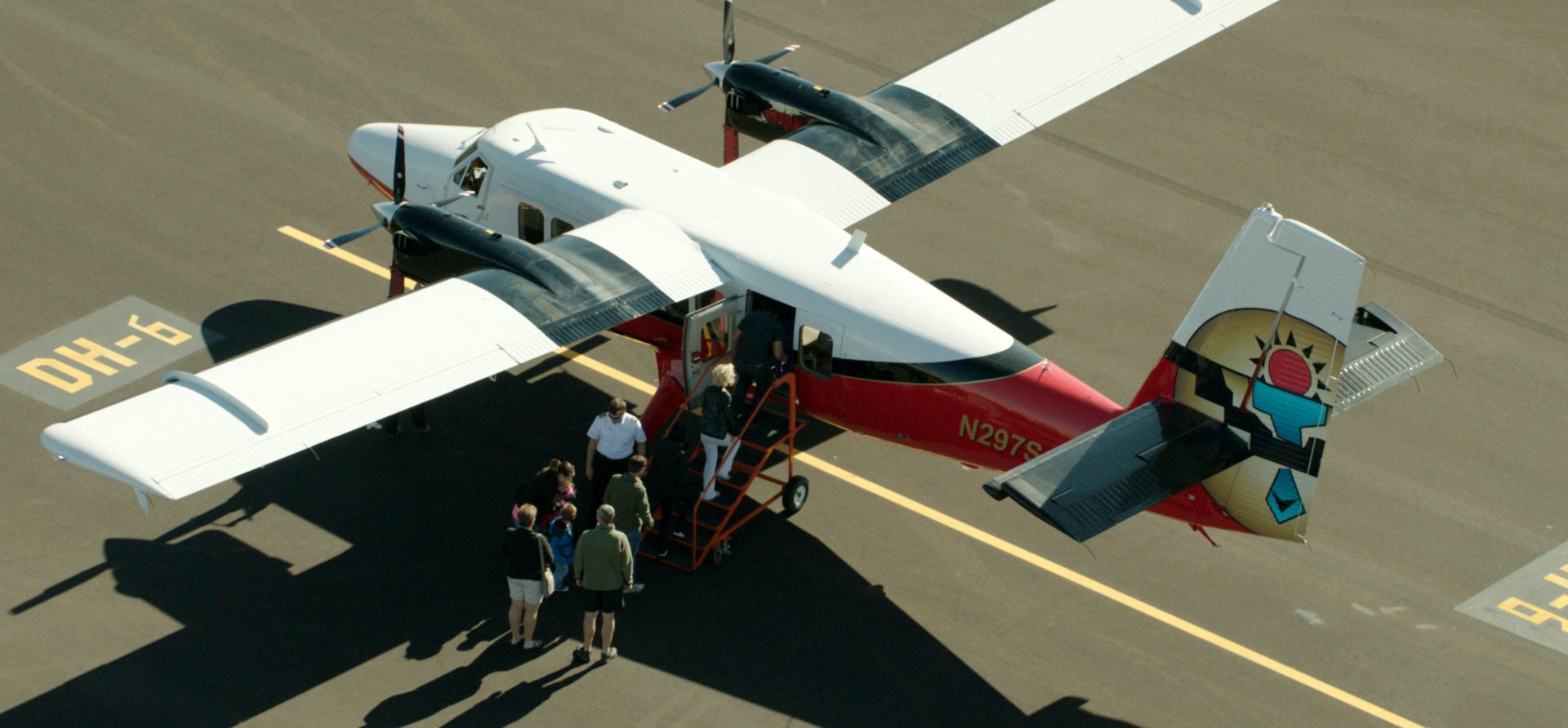 Passengers board a sightseeing airplane en route to the Grand Canyon