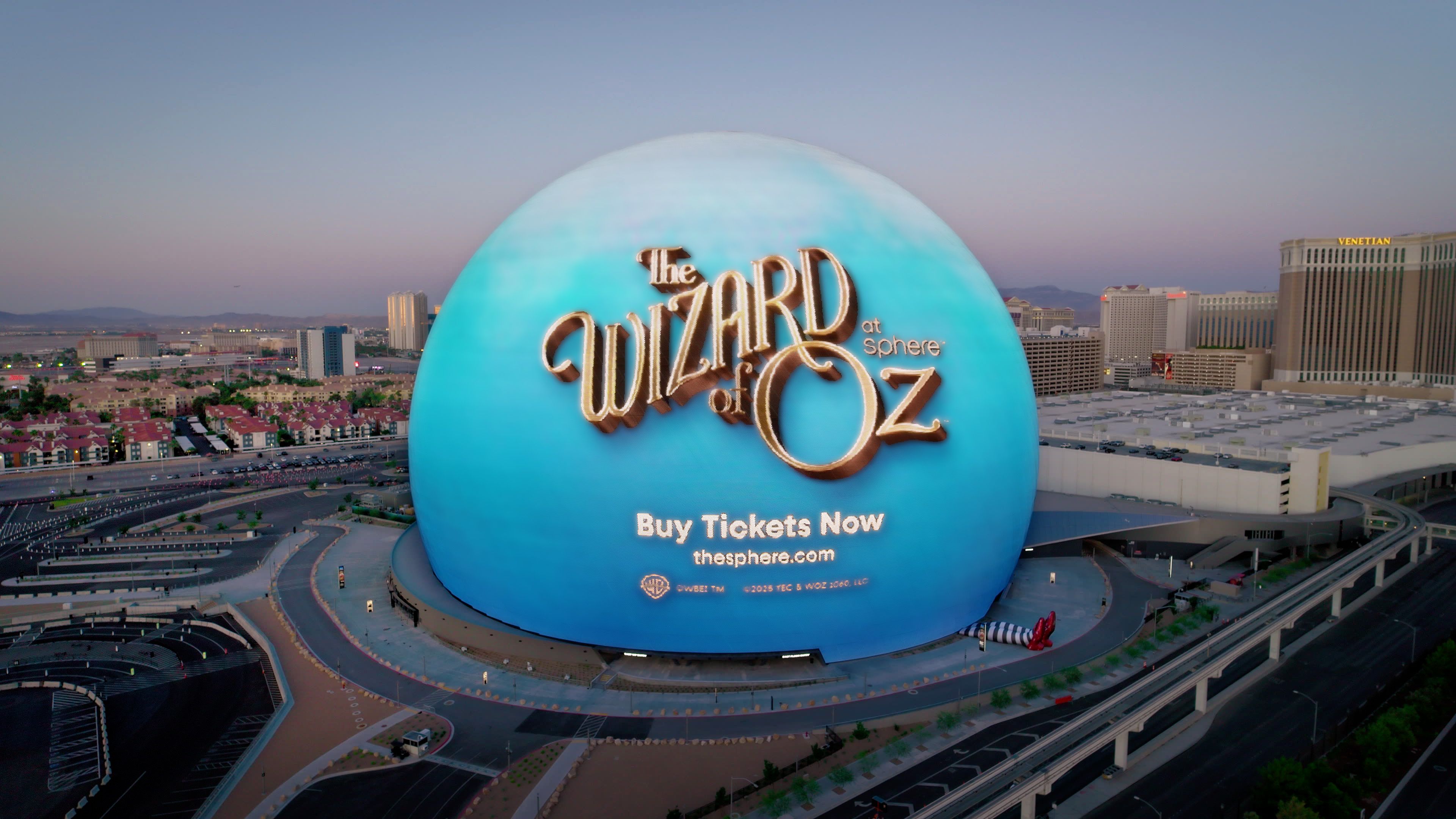 an aerial view of the Sphere on the Las Vegas Strip promoting its Wizard of Oz show