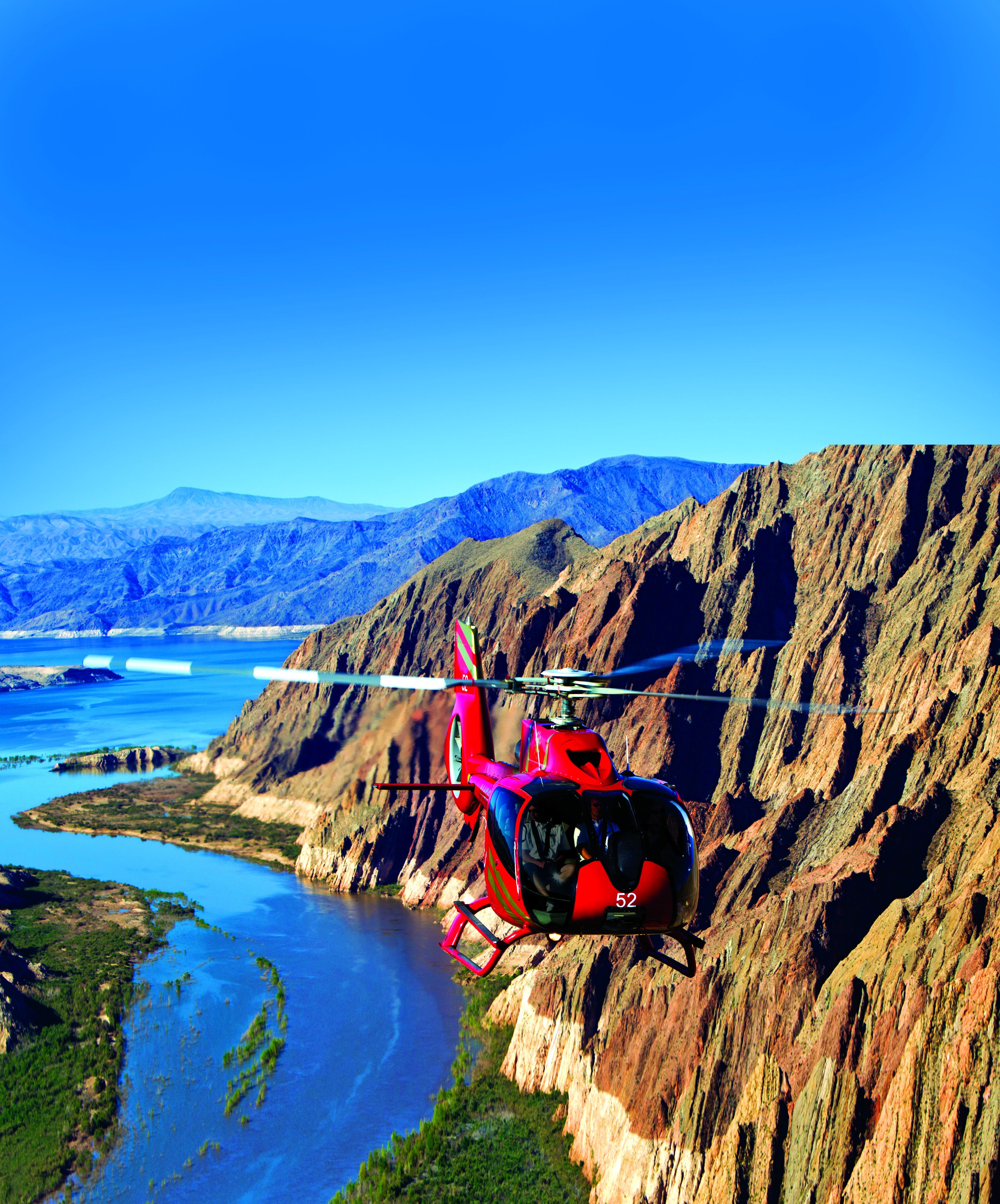 A helicopter flies over Lake Mead en route to the Grand Canyon
